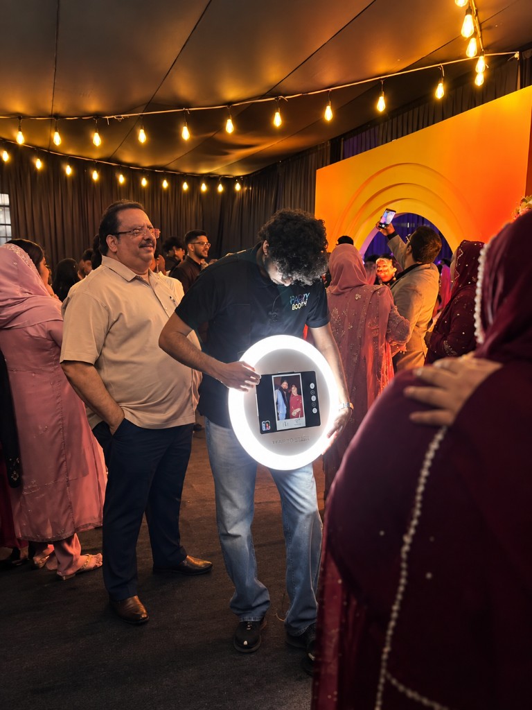 PartyBooth India Roaming Glow Photobooth moving among guests at a wedding reception in Mananthavady, Wayanad